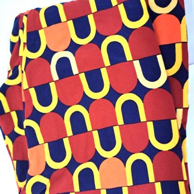 Lularoe Tall & Curvy Leggings Crazy print in orange, rust, yellow on Navy Ground